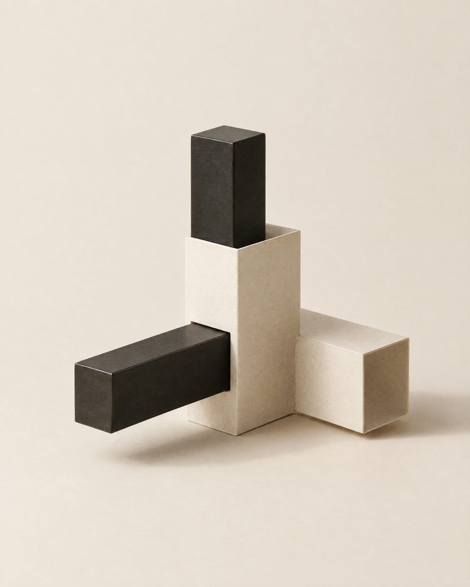 A black steel form and an off-white form interlocking exactly