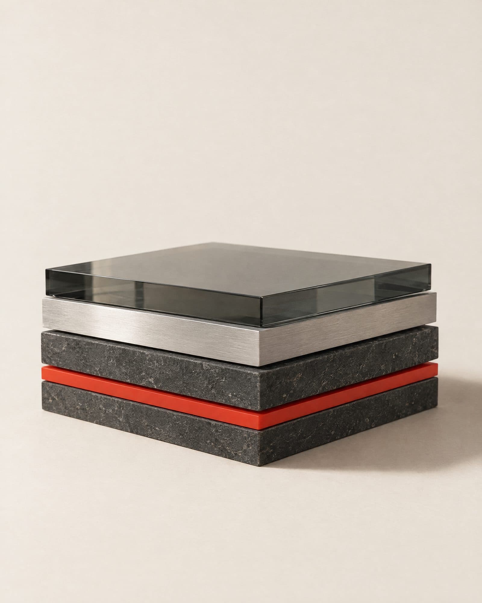 Layered slabs of glass, aluminium, stone and one red layer